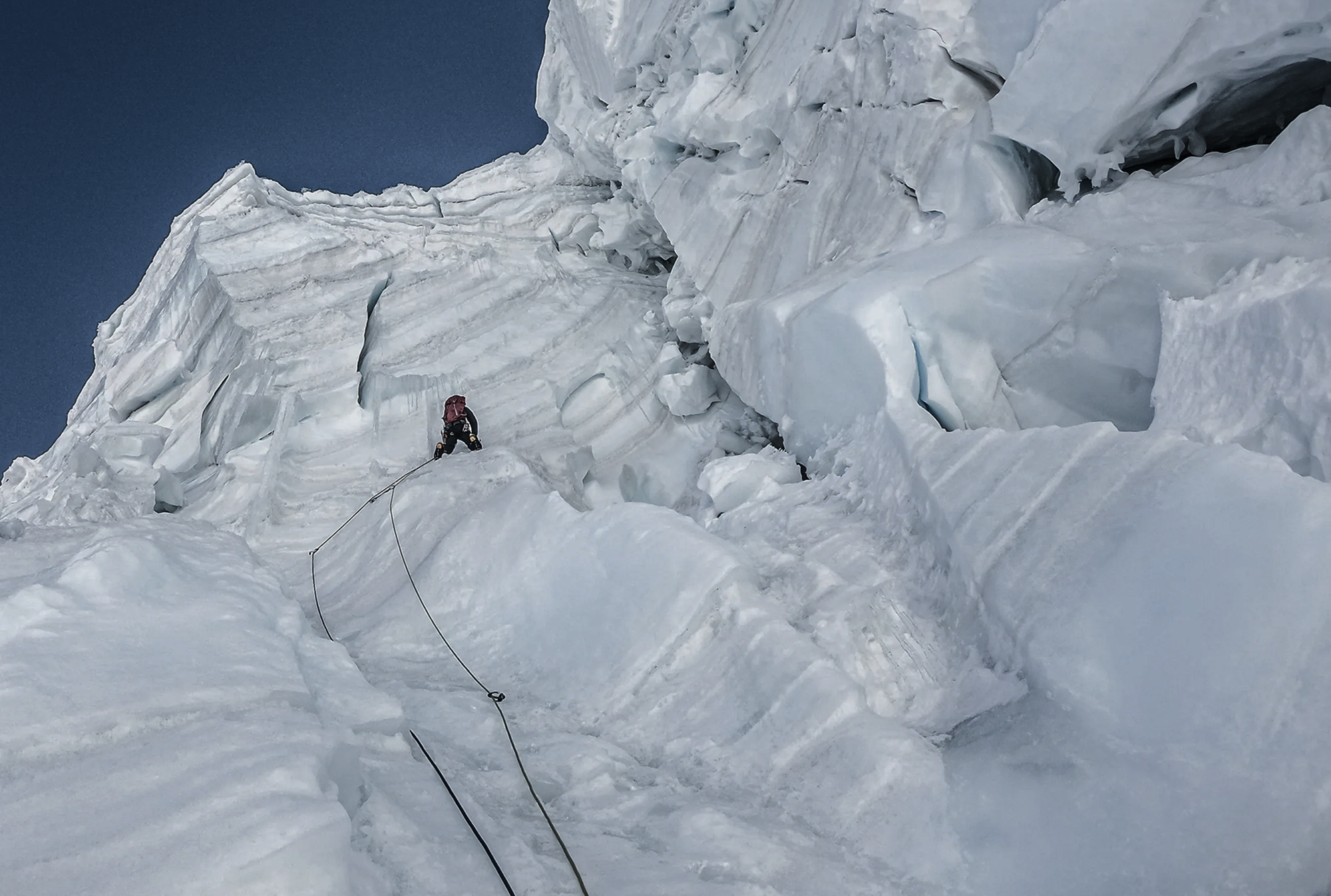 Climber ascending a steep ice section on Bhagirathi IV in the Garhwal Himalaya.