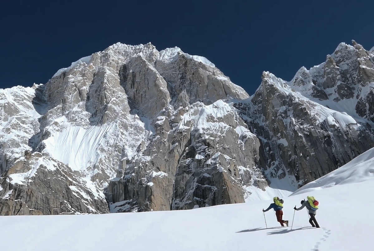 Jérôme Sullivan and Christophe Ogier approaching Pumari Chhish East across snow terrain in the Karakoram