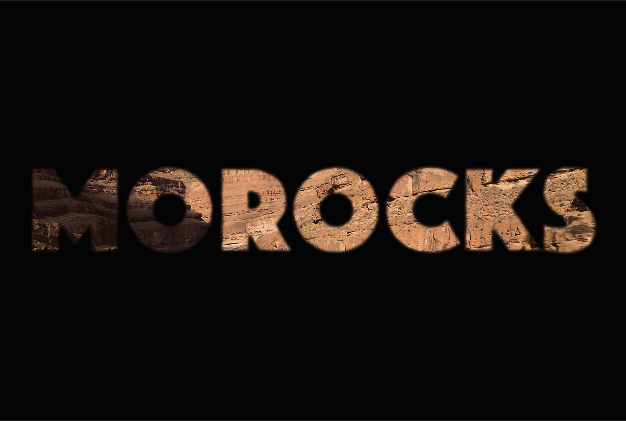 Black background with the word “MOROCKS” revealing an orange rock face through the letterforms.