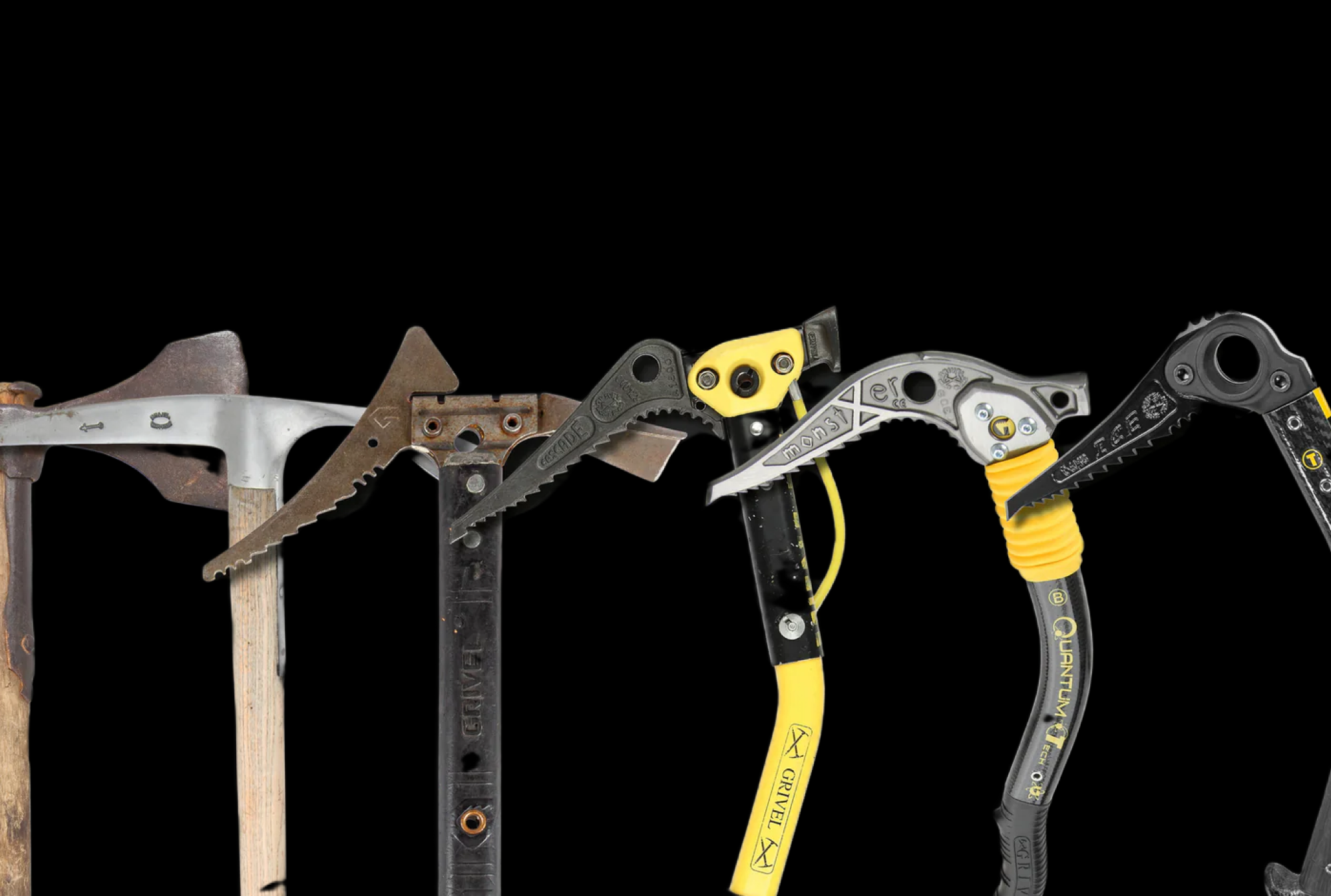 Historic and modern ice axe heads showing the evolution of blade design from early alpinism to contemporary technical ice tools.