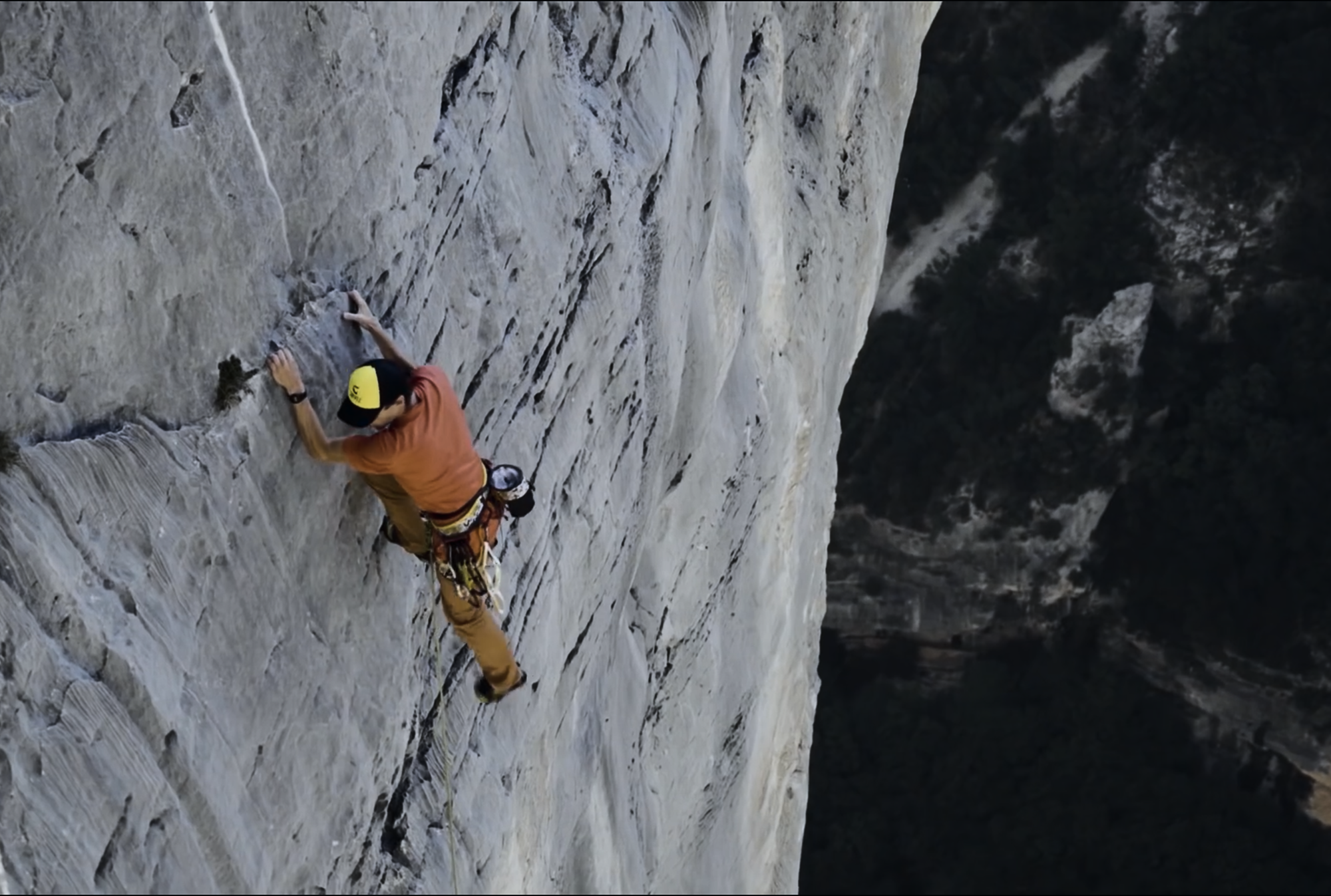 Climber ascending the limestone walls of Verdon Gorge.