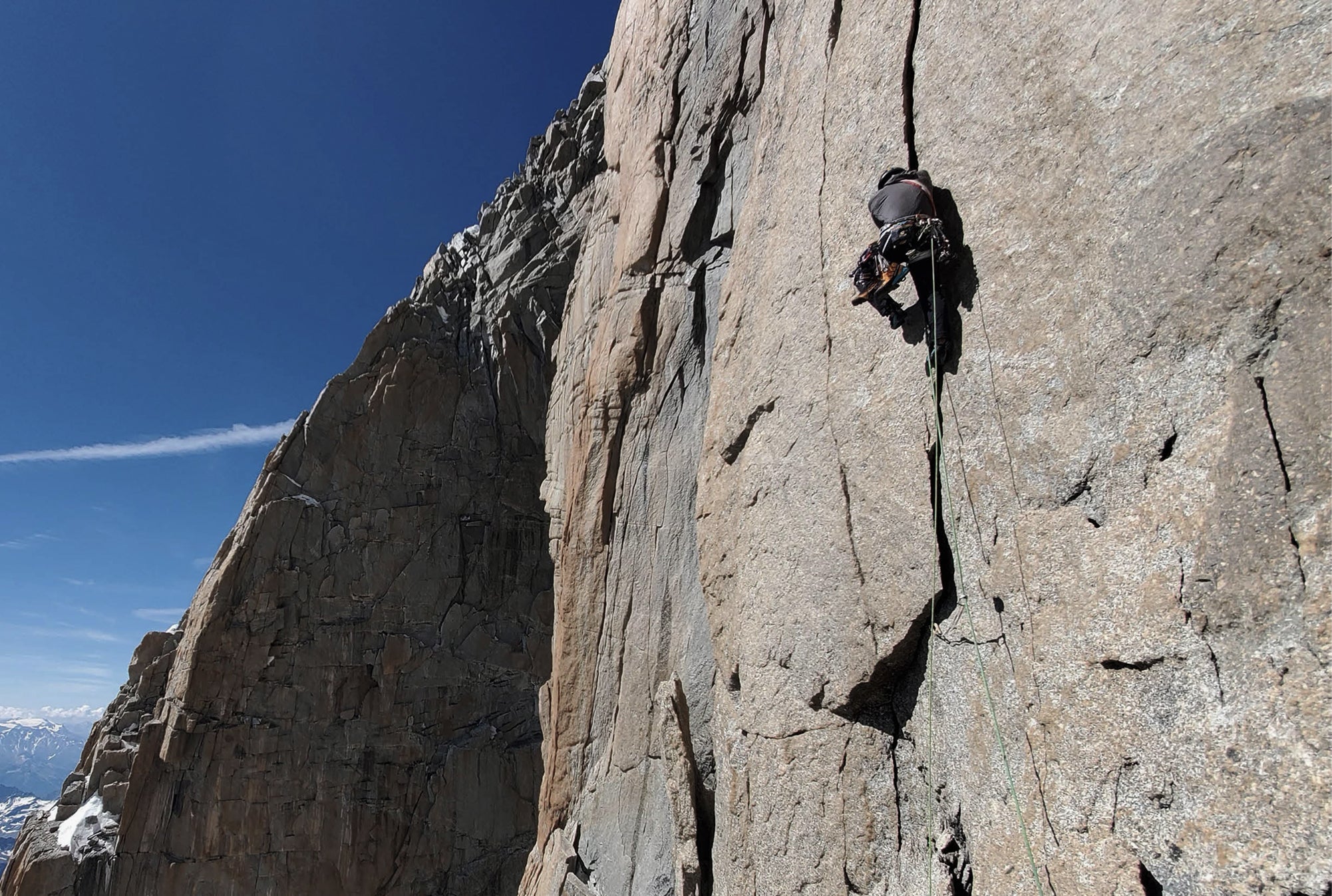 Climber ascending granite terrain during the Intégrale 2.0 project in the Mont Blanc massif
