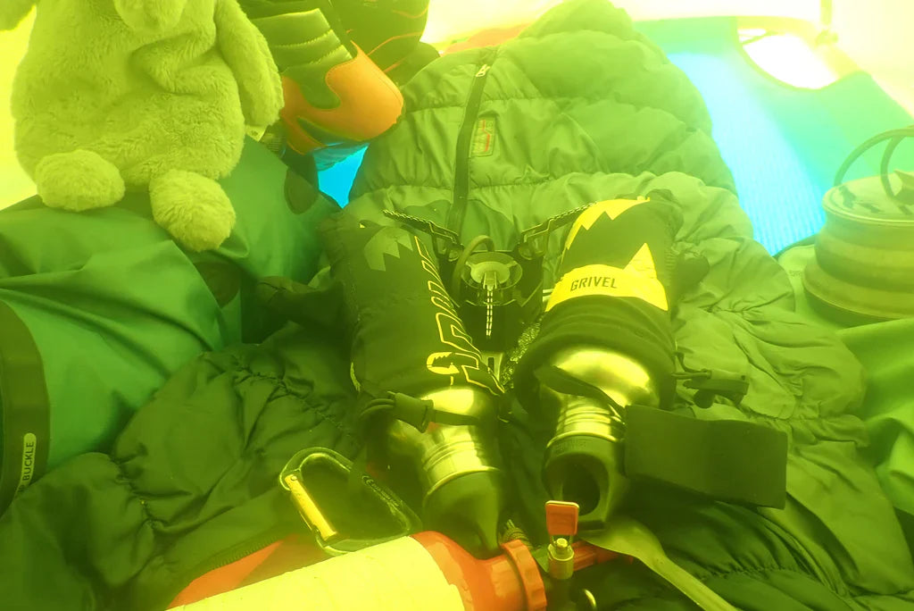 Stove and insulated bottles inside the portaledge during the ascent