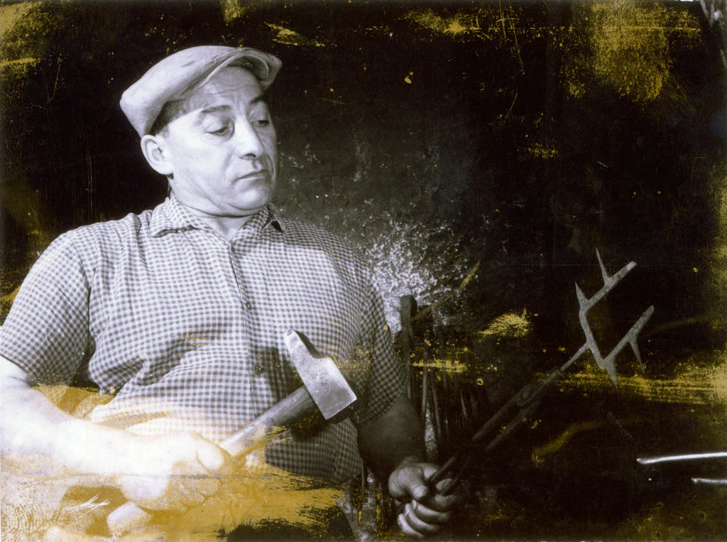 Historic Grivel forge and blacksmith at work in Courmayeur
