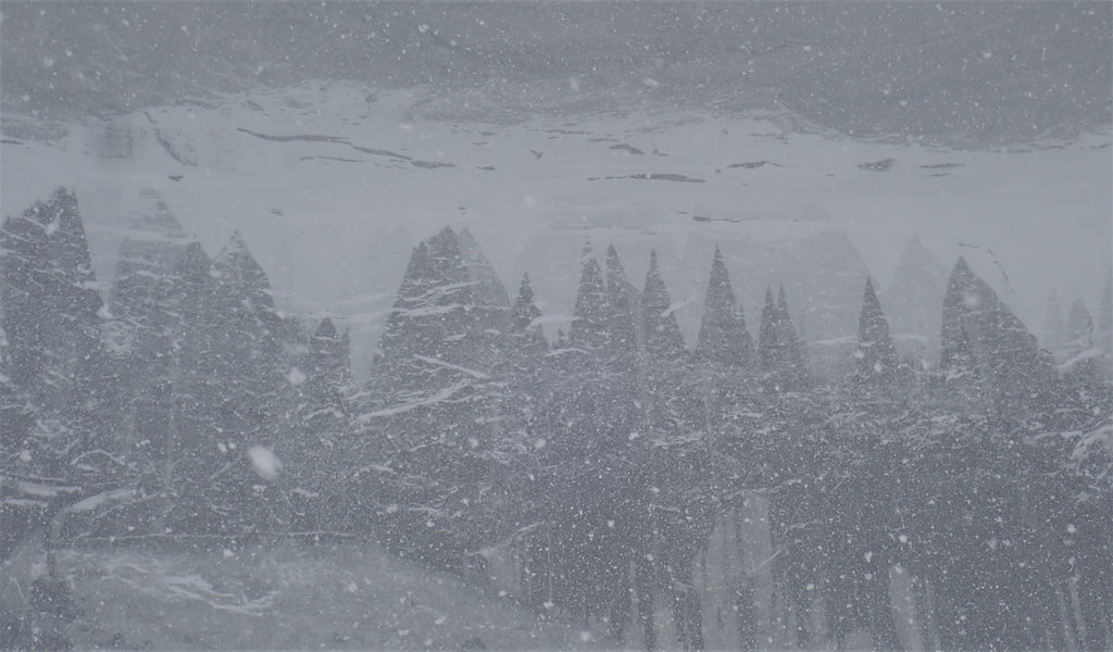 Snowfall and ice formations on the north face of Polar Sun Spire