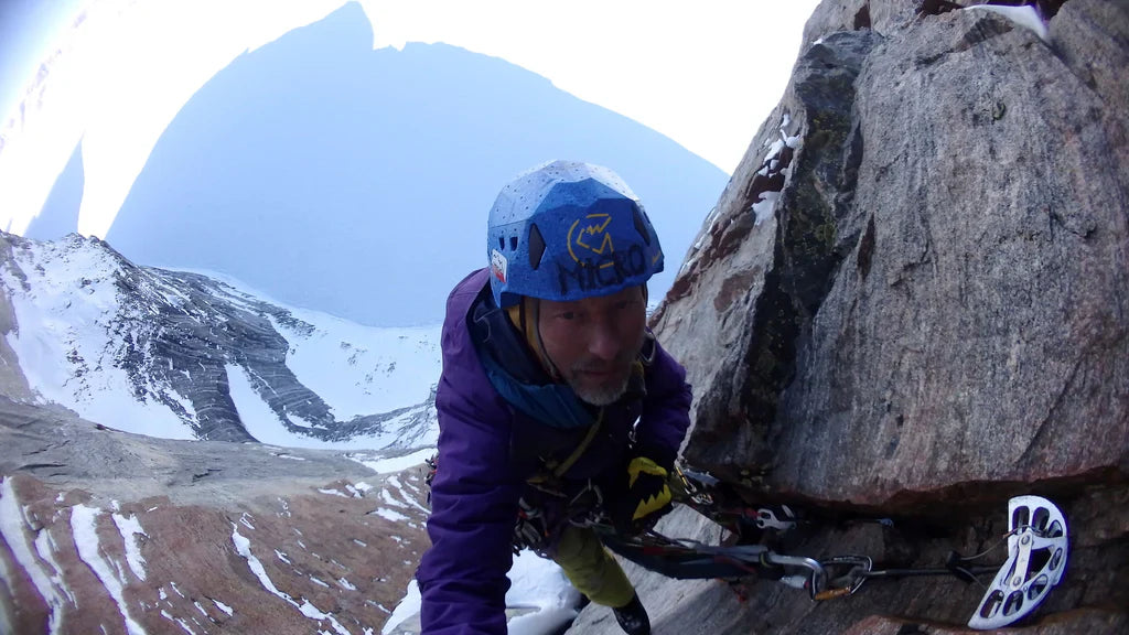 Marek Raganowicz climbing steep terrain on Polar Sun Spire