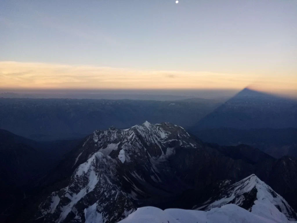 Evening view across alpine ridges from a high Karakoram summit.