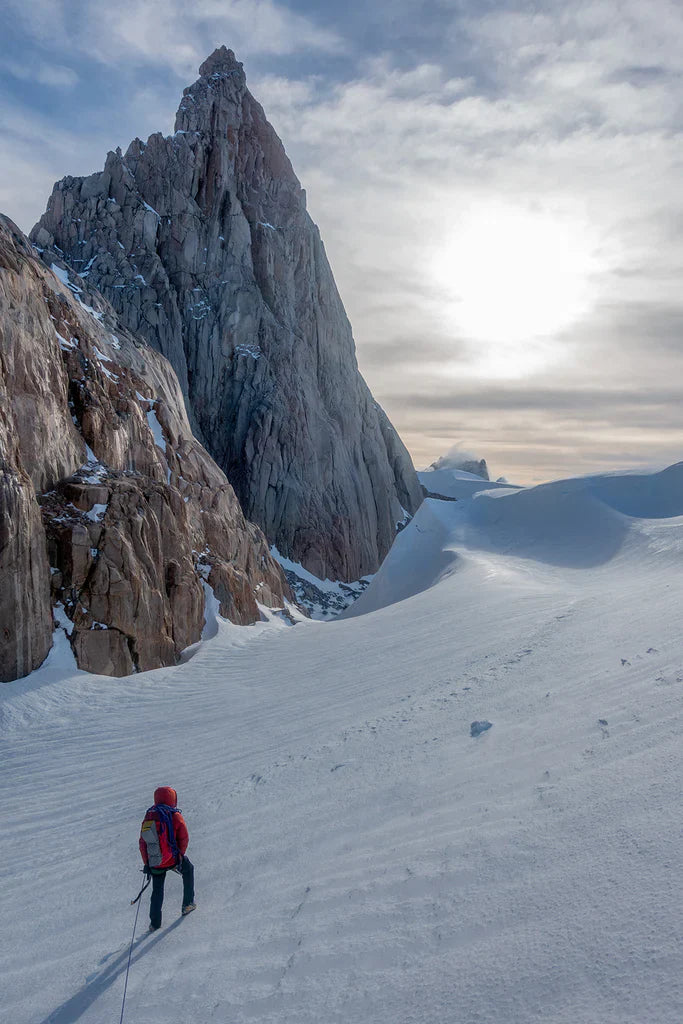 Luca Schiera approaching steep granite terrain below Cerro Nora Oeste