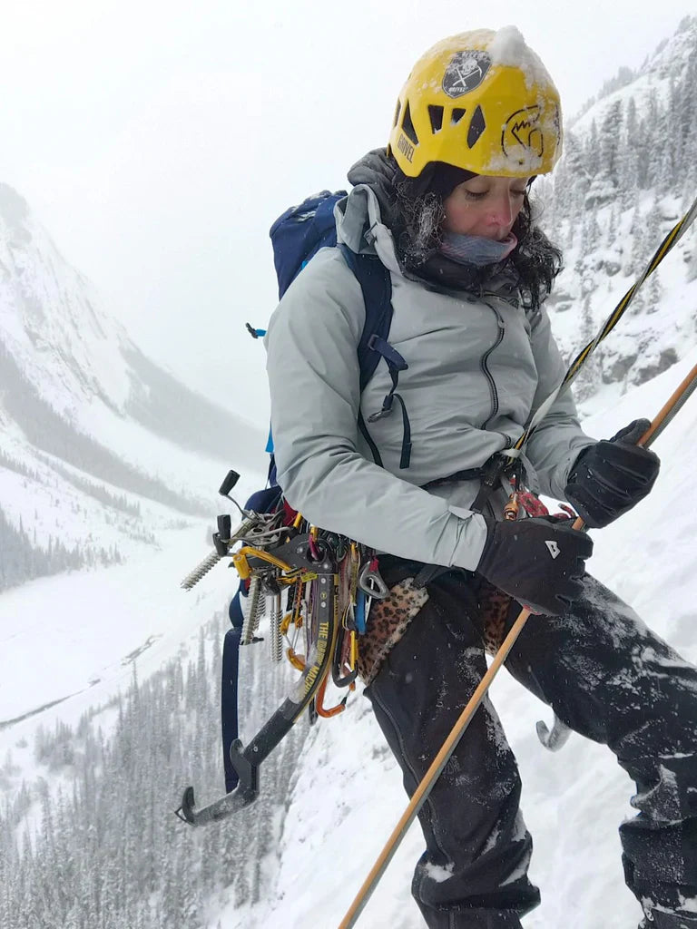 Charlotte Barré preparing gear during an ice climbing day in the Canadian Rockies.