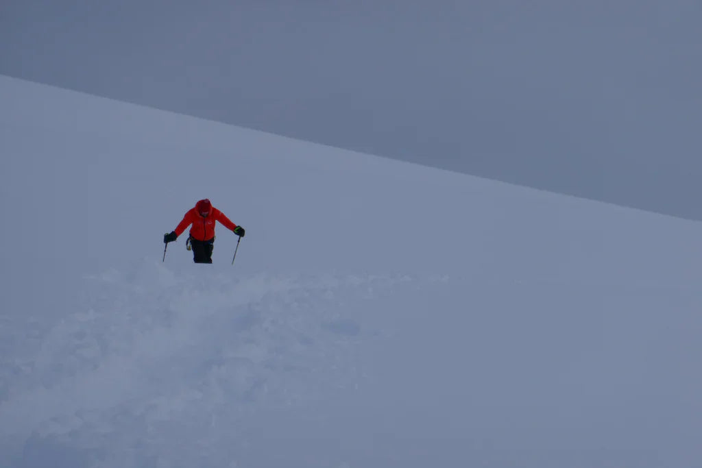 Mountaineer ascending deep snow on Manaslu during the 2019 expedition.
