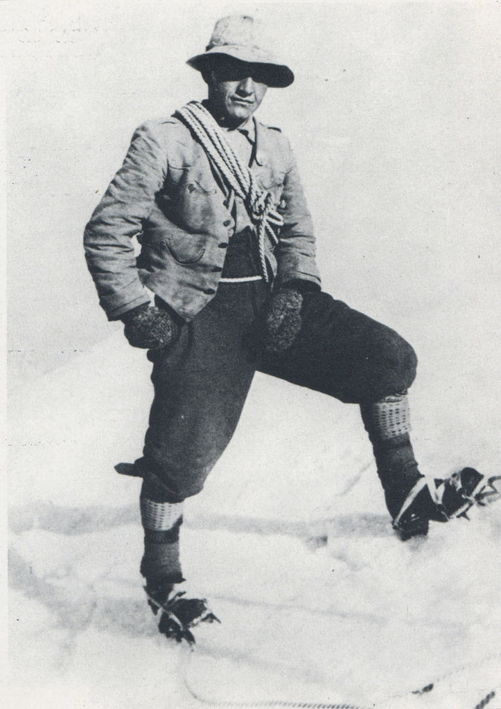 Early Grivel crampons beside a mountaineer wearing ten-point crampons