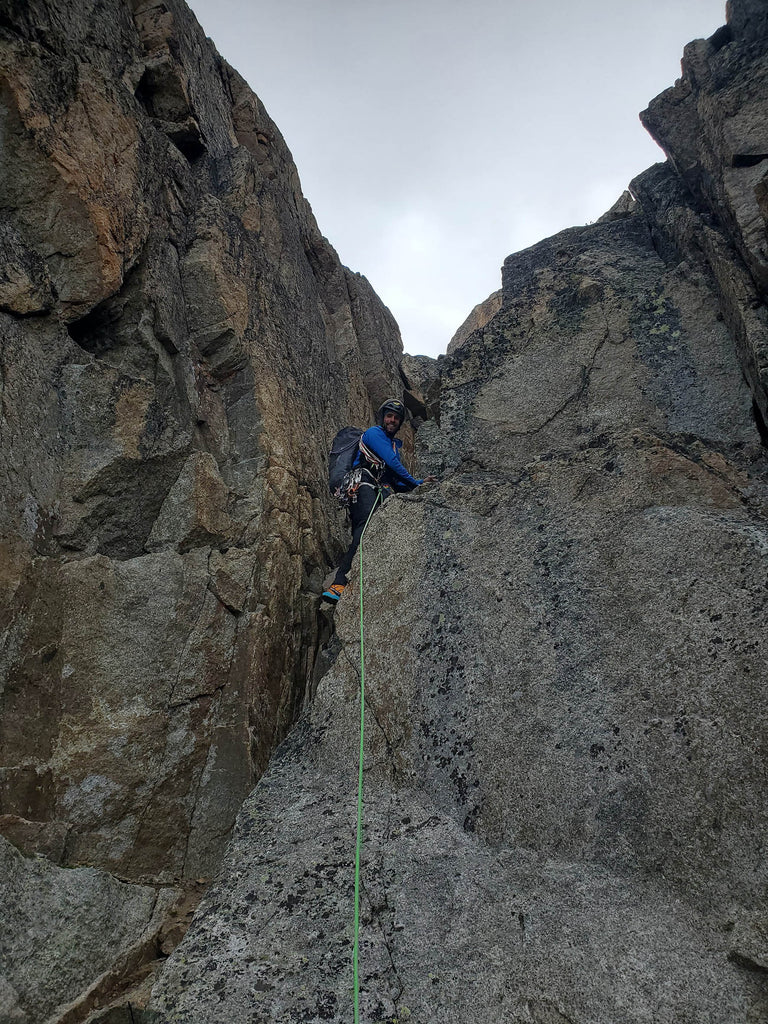 Damien Tomasi climbing technical granite terrain during Intégrale 2.0