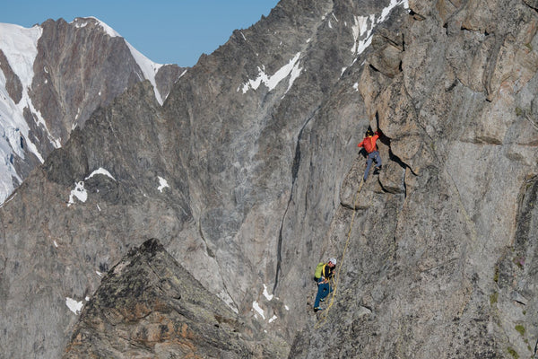 François Cazzanelli and Andreas Steindl climbing steep rock terrain on the Peuterey Integral.