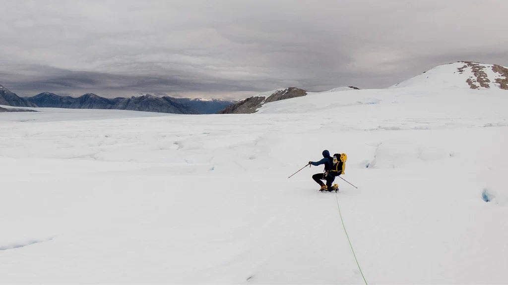 Climber moving across exposed snow terrain in Patagonia