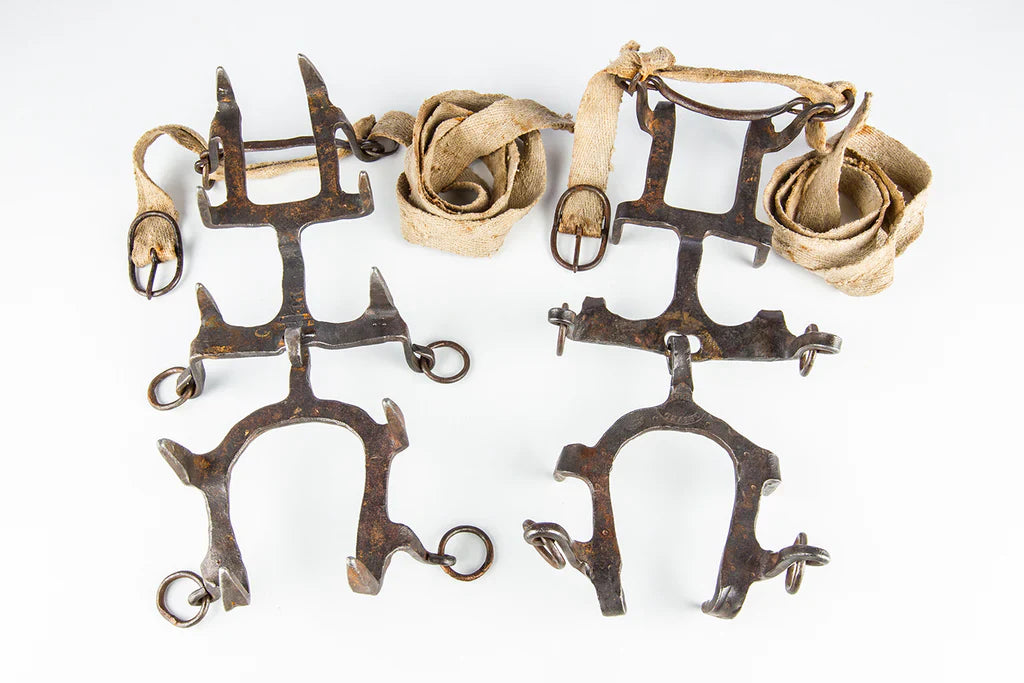 Historic forged Grivel crampons with leather binding system from the early development of modern alpinism