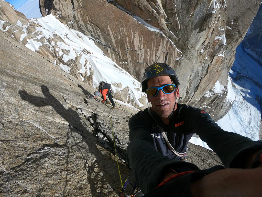 Tomás Aguiló climbing exposed granite terrain on the north face of Cerro Torre