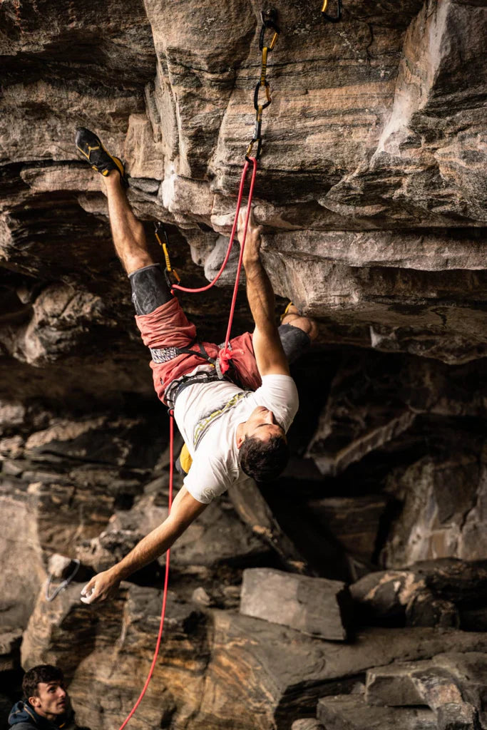 Marcello Bombardi climbing overhanging formation inside the cave terrain in Flatanger.