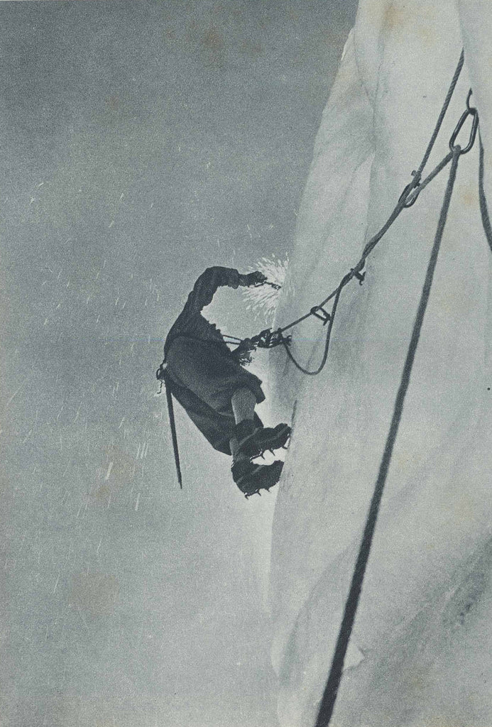 Ice climber using crampons on steep frozen terrain