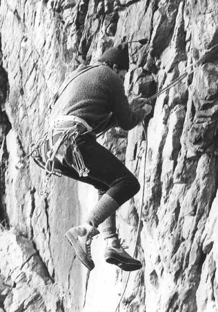 Historic alpine climber on technical rock terrain