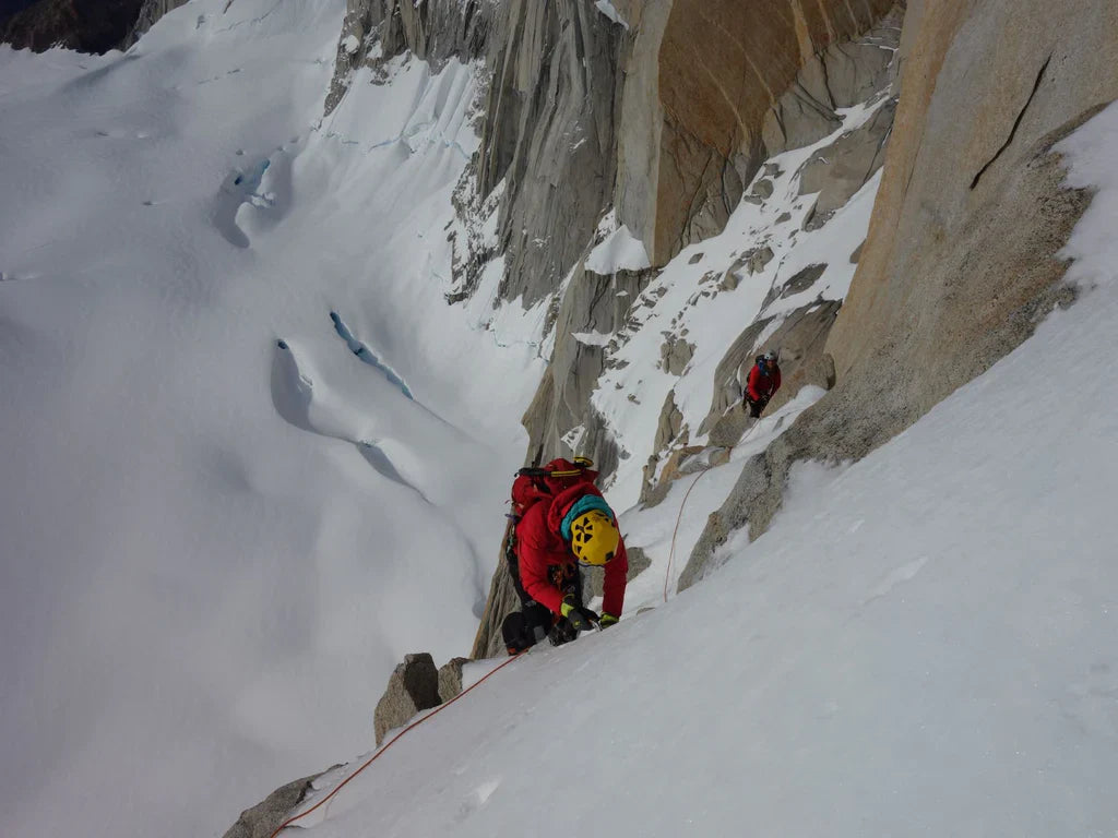 Silvia Loreggian and Stefano Ragazzo moving through steep snow and granite terrain during a Patagonian ascent.