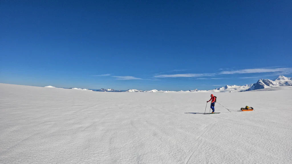 Skier crossing remote glacier terrain in Patagonia