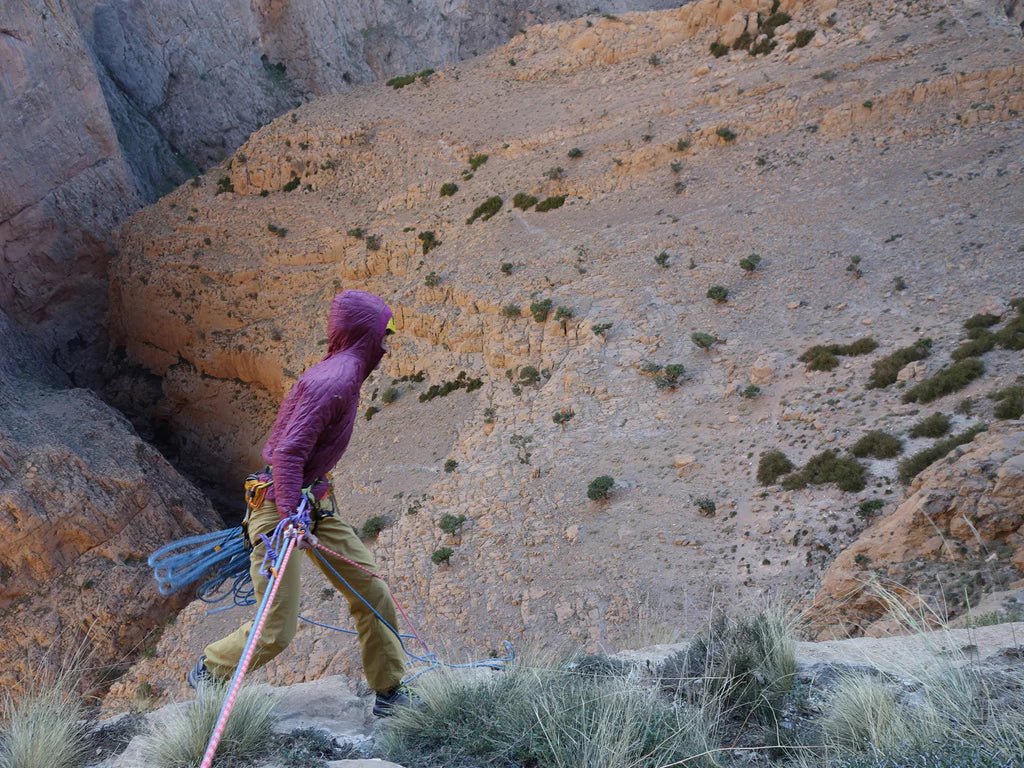 Silvia Loreggian standing above a steep canyon during the Taghia expedition.